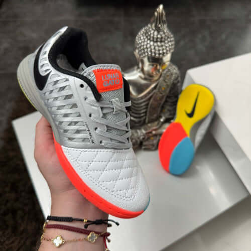 NIKE Lunar Gato Futsal Hombre shoes in silver and orange with colorful sole, perfect for indoor soccer performance.